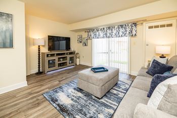 a living room with a couch and a tv at Seven Oaks Townhomes, Edgewood, Maryland, 21040